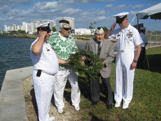 PEARL HARBOR PEARL REMEMBRANCE HARBOR REMEMBRANCES Left to right: Board Member Senior Chief Alan Starr, Pearl Harbor survivors John Zarli and Abe Stein and CMC Slator USN of the USS Boone laying the
