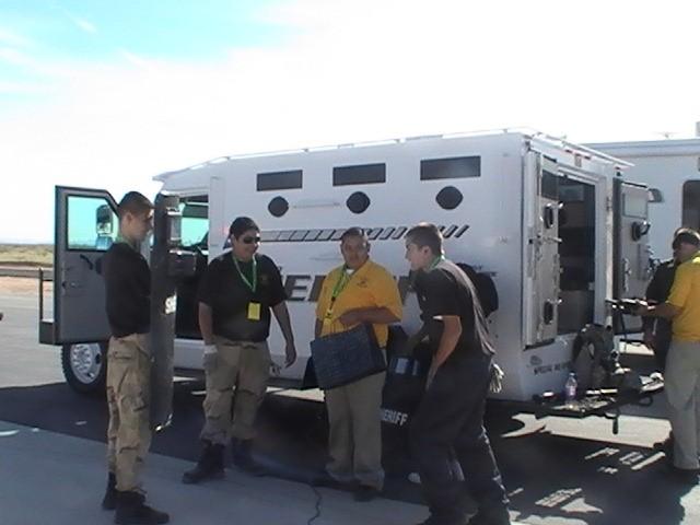 The SWAT Armored Truck and SWAT equipment were displayed to people by Deputy Darrel Rackley and Deputy Omar Montoya.