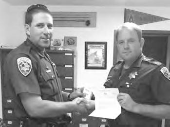letter of congratulations in  Duane Bowers presented Sergeant Jason Wickum