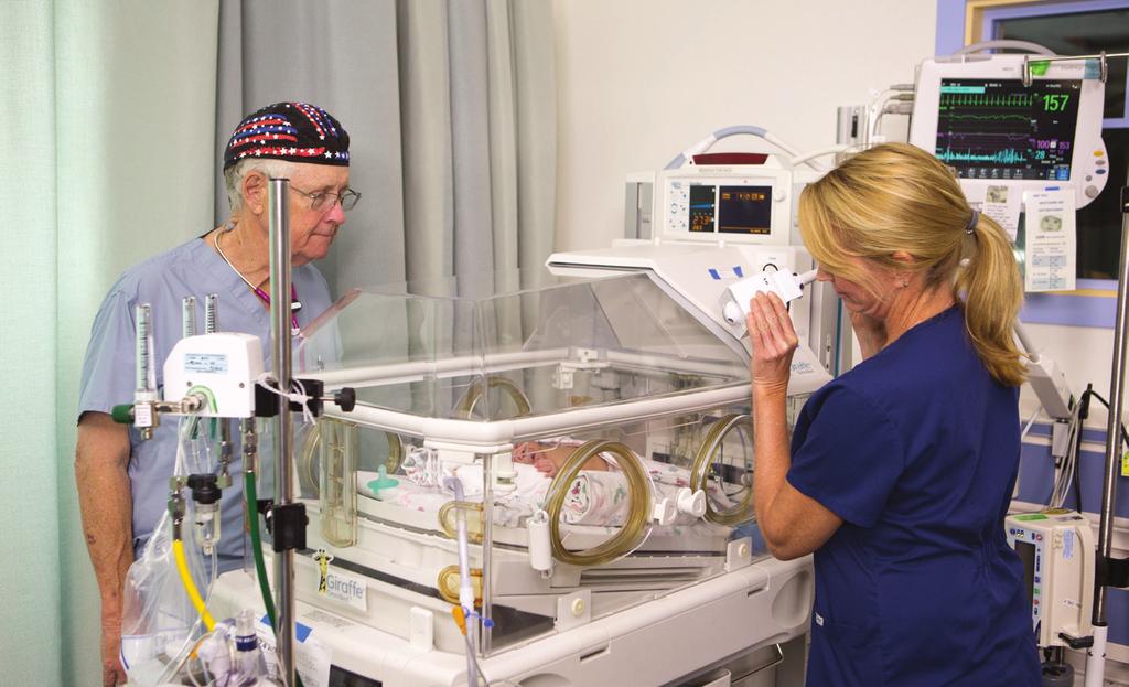 Hoag nurse adjusts NICVIEW camera for a better look at baby Supporting Mothers and Babies NICVIEW Cameras and Telehealth Installed in Hoag s NICU From tiny preemies with underdeveloped lungs to term