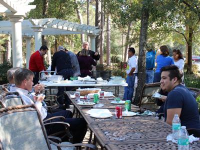 .. Community and staff gathered for a delicious lunch made by José Perez to