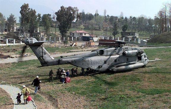 Command and Control During Operation SILVER WAKE, American citizens board a helicopter from the 26th Marine Expeditionary Unit on a field inside the United States Embassy housing compound in Tirana,