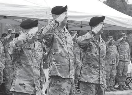 MEDDAC welcomes new command team Col. Eric Edwards, Maj. Gen. Pete Johnson, and Col. Chad Koenig salute the colors, during a change of command ceremony April 27.