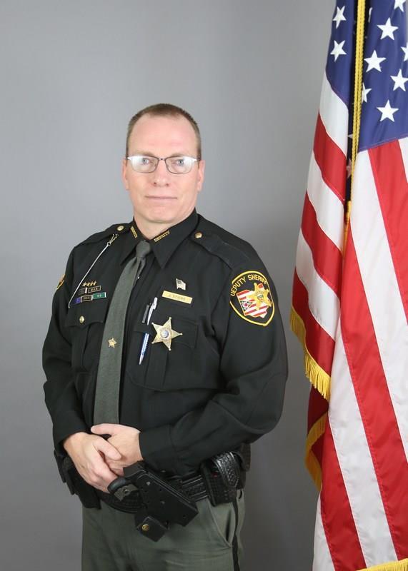 55 DEPUTY OF THE YEAR (Certificate and black/orange award bar) Detective Jeff Stiers was nominated for deputy of the year because of his leadership, strong work ethic, high standards, and the