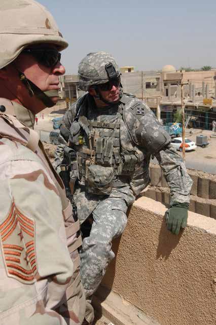 Chief Master Sergeant Curtis Brownhill (left), command senior enlisted leader of U.S. Central Command, stands atop a patrol base in Tarmiya, Iraq, with Command Sergeant Major Ronald Riling, 4 th Infantry Division, August 21, 2006.