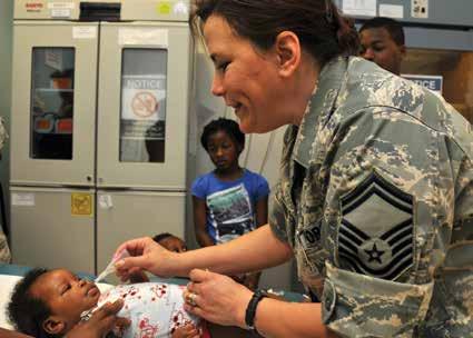 Air Force Senior Master Sergeant Virginia Westover with the 179 th Medical Group works at the immunizations and