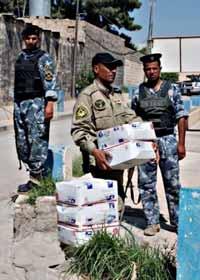 Chris Medina, deputy provost marshal for CP-North, loaded the first delivery of dog food from the scouts, of which Medina s nephew is a member, packed into approximately 15 flat-rate boxes in the