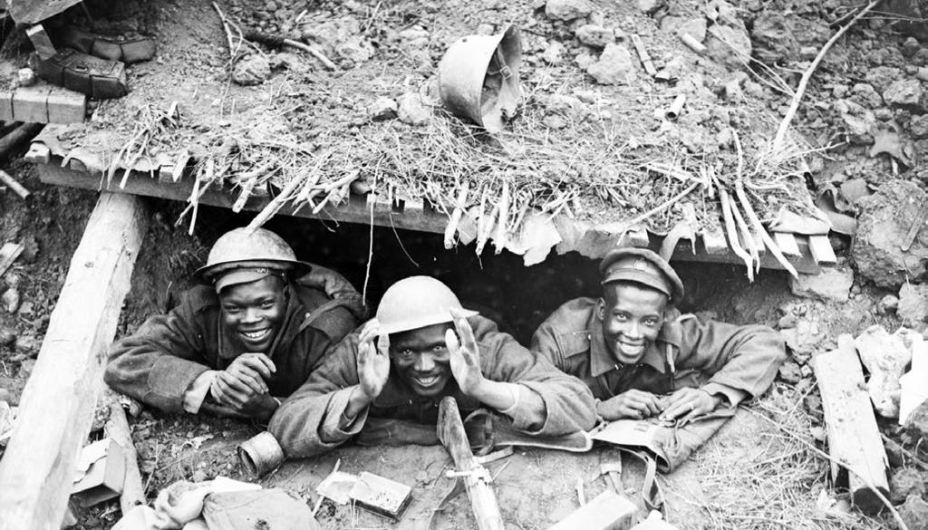 William Rider-Rider/DND/Library and Archives Canada/PA-003201 Three Black-Canadian soldiers in a captured German dugout during the Canadian advance east of Arras.