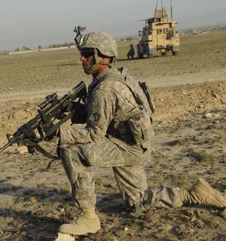 Matthew Lohr Spc. Jupitor Rincon, a member of C Co., provides security for fellow members of Khost PRT during a dismounted patrol to a key leader engagement April 6.