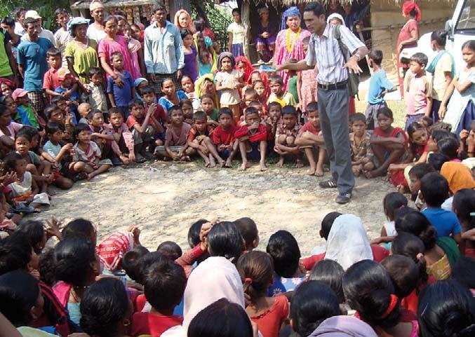 Acute malnutrition Integration of CMAM into routine health services in Nepal CMAM field monitor, Rang Bahadur Nepali, from CDO informing a community in Daudakala, Bardiya district about CMAM Concern