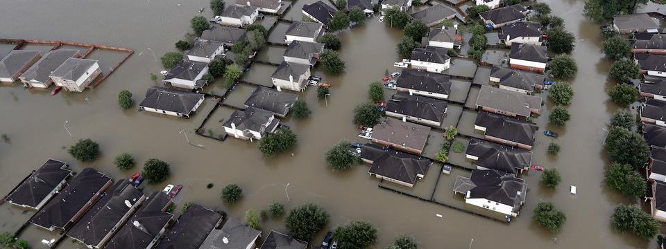 Homes are surrounded by Harvey's floodwaters on Tuesday,