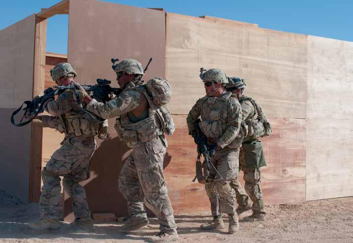 Infantry squad with 2 nd Armored Brigade Combat Team, 1 st Armored Division, assaults first of two buildings during platoon live-fire lane, January 28, 2018, during Omani-U.S.