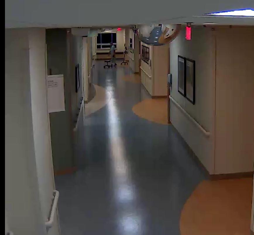 Hospital surveillance still image showing the decedent coming from his room
