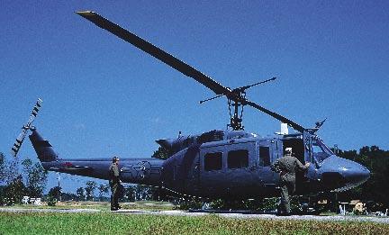 At right, a Huey II undergoes an inspection. We train our students here with a global mission emphasis, said Collins.