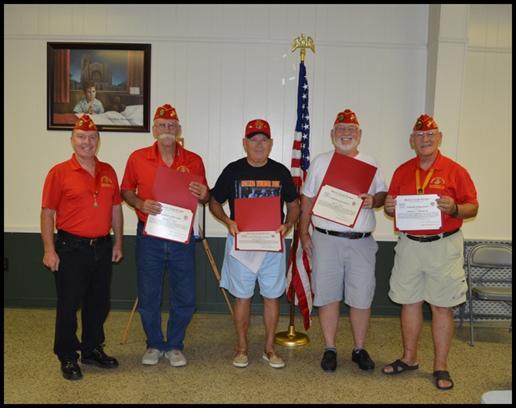 Awards Page 10 Commandant Tim Manchester presents awards to the members of Marine Corps League Swansboro Detachment #1407, for their outstanding contributions to the