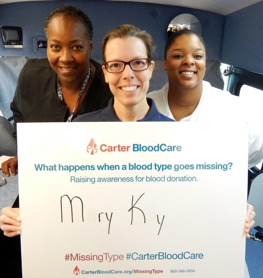 Top: During a blood drive on August 20, 2016, in Rockwall, Texas (L-R) Tammy Morgan, 1st Lt Mary Kay Starnes and Tiffany Woodatol ask what would happen if no one had a patient s blood type in an