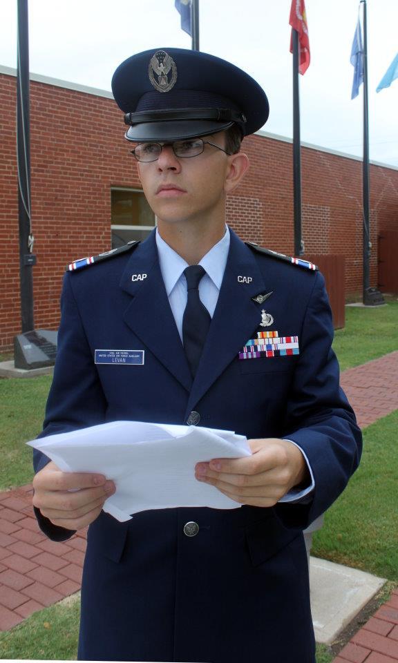 Right: Cadet Maj/ Kurt LeVan reads the 68 names of Civil Air patrol members who died during service in World War II.