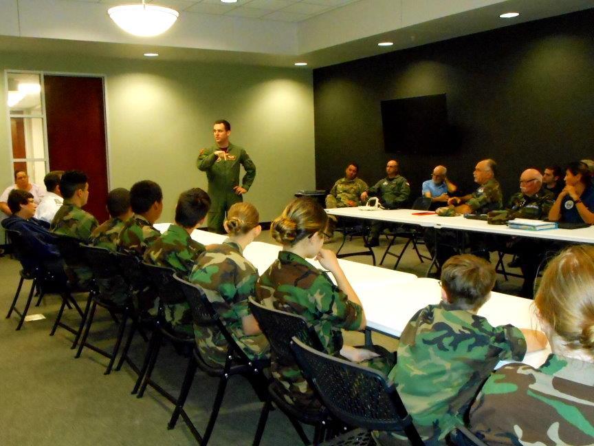 Left: USAF Sr. Airman Stephen Roquemore addresses the squadron. Below: USAF Sr. Airman Stephen Roquemore chats with cadets. The Sugar Land Composite Squadron sent Lt. Col.