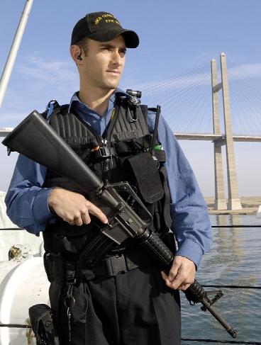 Leading Seaman Michael Murphy, a member of Charlottetown s force protection team, observes the banks of the Suez Canal while going under the Mubarak Bridge.