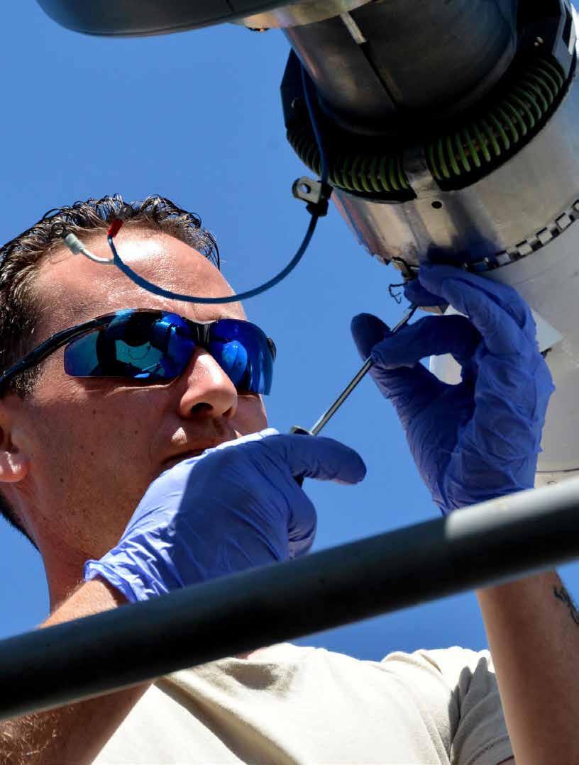Senior Airman Travis Krause, a crew chief assigned to the 507th Air Refueling Wing, Tinker Air Force Base, Oklahoma, removes the boom nozzle from a KC-135R Stratotanker in order to connect a drogue