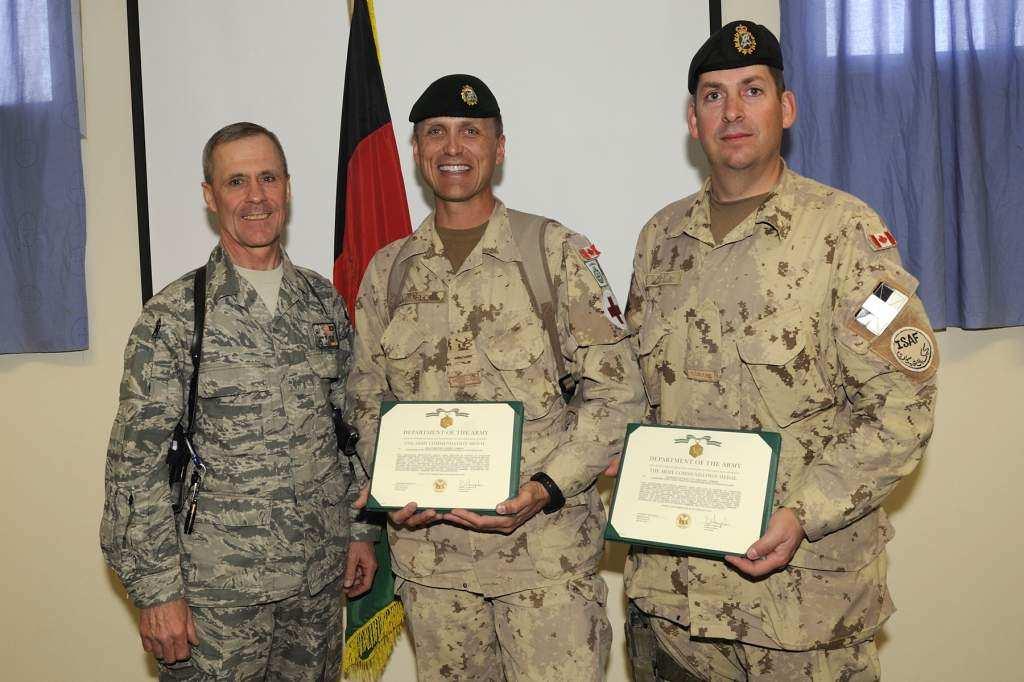 Maj Mike Kaiser and WO Todd Sinclair received Army Commendations and Medals from Col Heyne, CO of the USAF Embedded Training Team, for their ground-breaking