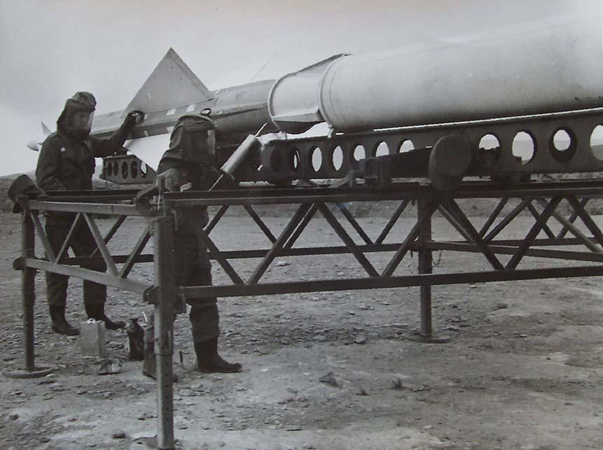 Figure 49 Crewmen fueling or slugging an Ajax missile in an early version of the protective suit.