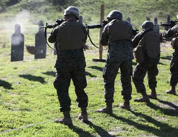 Marines shoot for combat accuracy Story and photos by Pfc. Timothy Childers MARINE CORPS BASE CAMP PENDLETON, Calif.