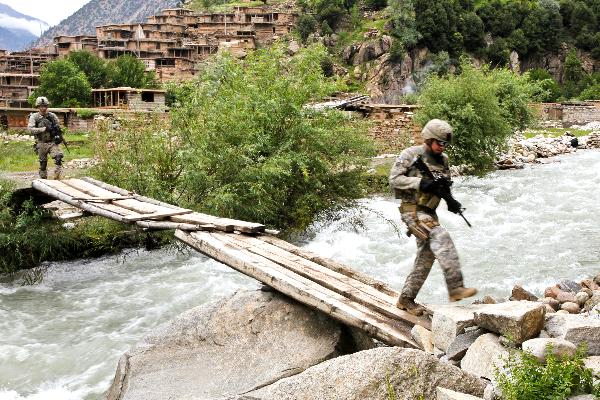 14 of 18 8/16/2010 1:21 PM U.S. Army soldiers advance through the town of Barge Matal as part of Operation Azmaray Fury in Kunar province, Afghanistan, July 28, 2010.