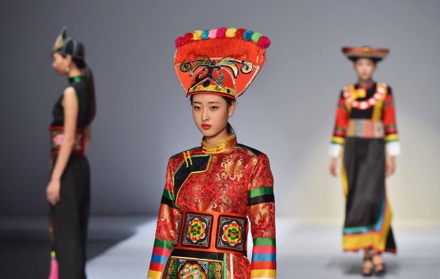 China ABC Chinese folk costumes show opens in Beijing Models present creations by designers from a workshop focused on China's folk costumes at Beijing Institute of Fashion Technology in Beijing,