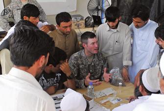 CPT Jeffrey Mann, a soil scientist from the Kansas Army National Guard, teaches students from Nangarhar University how to test soil at a class at Forward Operating Base Mehtar Lam s district research