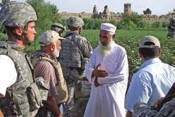 Right, members of the Missouri Army National Guard s ADT visit with a farmer and discuss agricultural assistance in eastern Afghanistan.