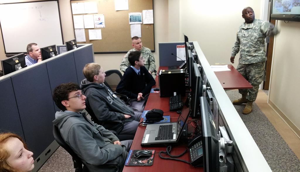 students and staff from Saint Dominic School at the Homeland Security Center of Excellence in Lawrenceville, N.J., Feb. 20, 2014. The students are competing in the U.S. Army ecybermission challenge to create a mobile application to assist the public during times of crisis.
