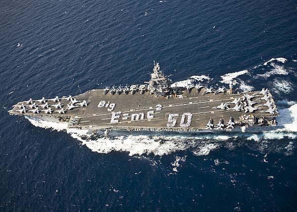 Figure 3. Sailors spell out E=MC2 on the flight deck of the aircraft carrier USS Enterprise (CVN 65) to commemorate the 50th anniversary of the ship s commissioning.