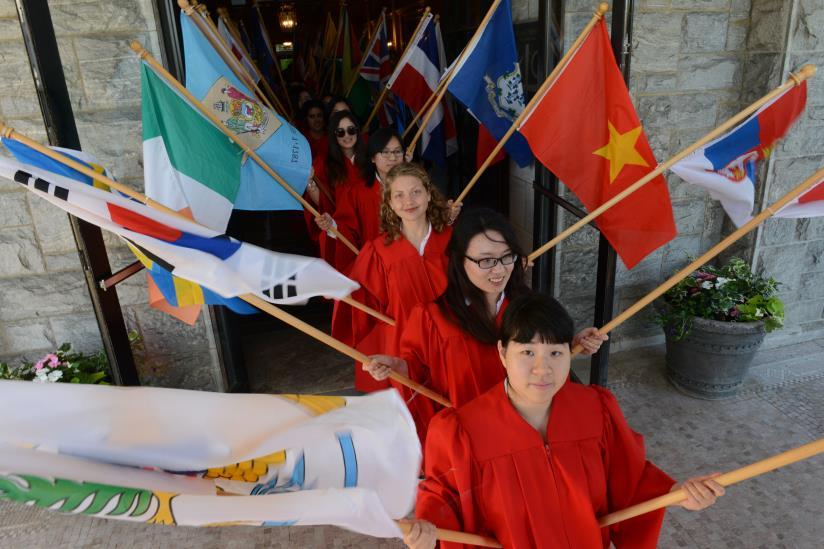 international program, stand in front of Reid Castle at the Manhattanville School of Business Doctoral and Masters Commencement, Thursday, May 14.