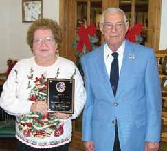 Carol Shelton received a plague presented by Director Joe Cody for her work in communications (printing and mailing the monthly minutes and newsletter),