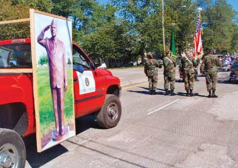Life-sized photo of Ohio Western Reserve National Cemetery statue is carried on Ray Torok s IN Woolybear Day Parade in Vermilion, OH (parade is held every October) Maria Garza,