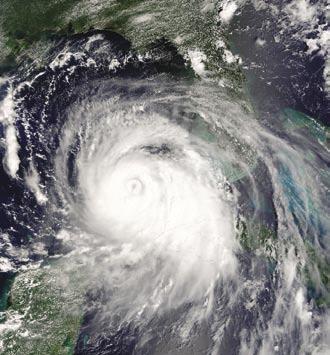 The satellite photo at right conveys a sense of the immense scope and magnitude of Hurricane Katrina, bracketed on the lower left of the photo by Mexico s Yucatan Peninsula, the