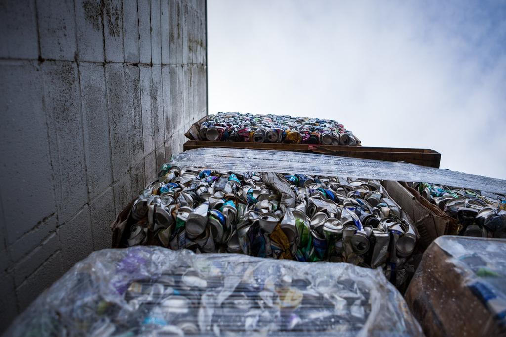 Photo of smashed aluminum cans in a prison recycling program by Benj Drummond and Sara Joy Steele.