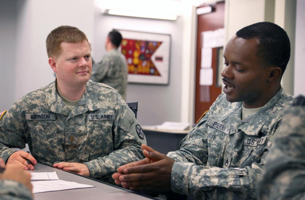 Second Lt. Isaac Brunson practices conducting noncommissioned officer counseling with Staff Sgt.