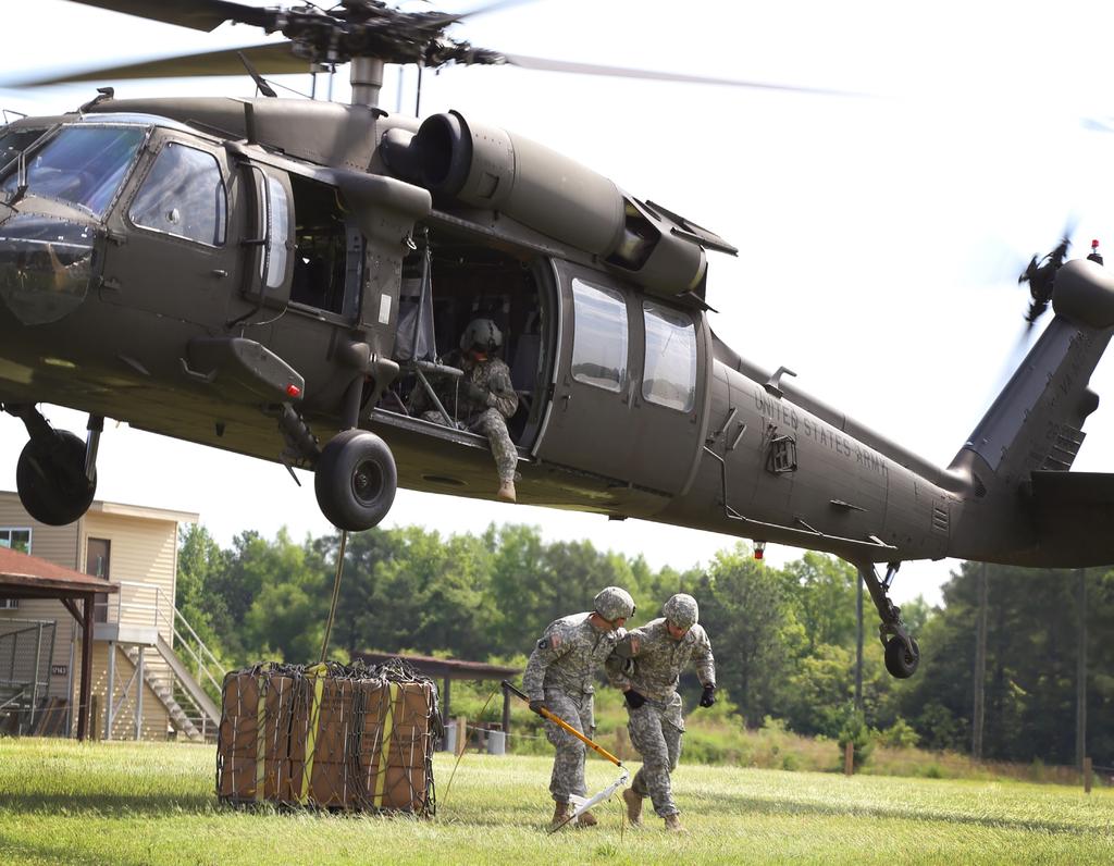 FEATURES A noncommissioned officer instructor trains a Basic Officer Leader Course student in properly attaching a sling load to a UH 60 Black Hawk helicopter.