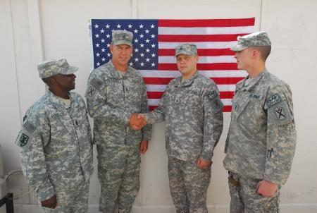 P a g e 5 Soldiers of the Month Sgt. Bobby R. Lane Jr. (right of center) of Blythewood, S.C.