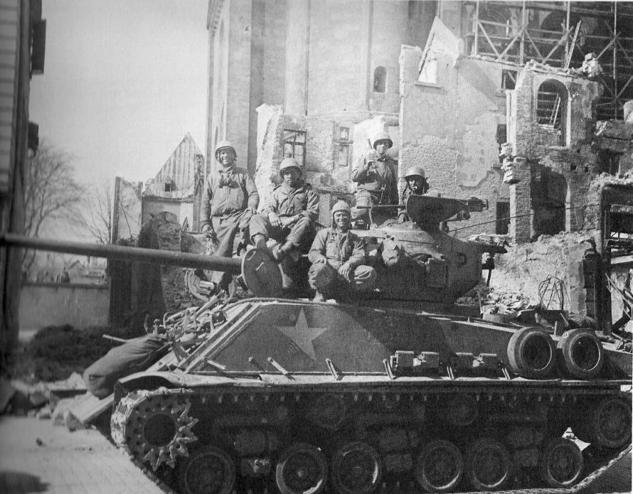 Because Marvin s tank led the column of tanks, his tank crew had the distinction of being the first to reach the Rhine River. That day was 9 March 1945. A famous Army photograph captured that event.