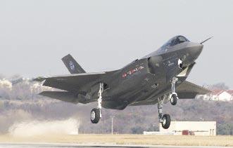 Lockheed Martin photo by Jack Noble The F-35 Lightning II takes off on its first flight. USAF officials want to buy F-35s in lots of 100 a year, but probably won t get that many. requirement for 381.