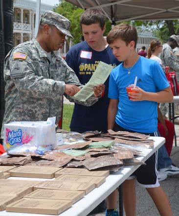 Youngsters also had the opportunity to try on some battle armor and sample Meals Ready to Eat.