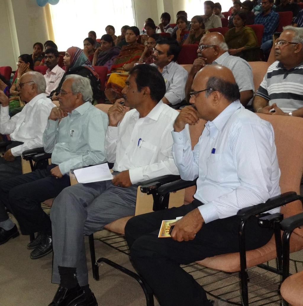 Students and Faculty Members listen while Dr.