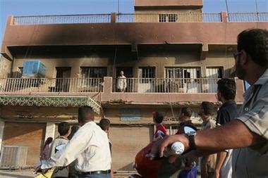 RECRUITING FOR THE ARMED RESISTANCE THAT IS Iraqi citizens stop to view a home that was burned during a raid by U.S., July 23, 2006, in Sadr City, Baghdad. (AP Photo/Karim Kadim) [Fair is fair.