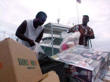 Marshallese Word of the Day Jaab (job) = No. (Photo by Peter Rejcek) Peterson Joe, left, and Scott Paul load toys donated by Kwajalein residents onto the Host Nation boat Wednesday afternoon.