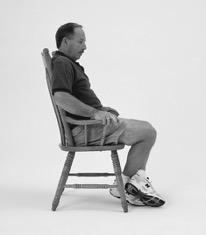 Plant foot and move bottom forward on chair. Repeat 30 times. (9) Extension Stretch Prop foot of operated leg up on chair.