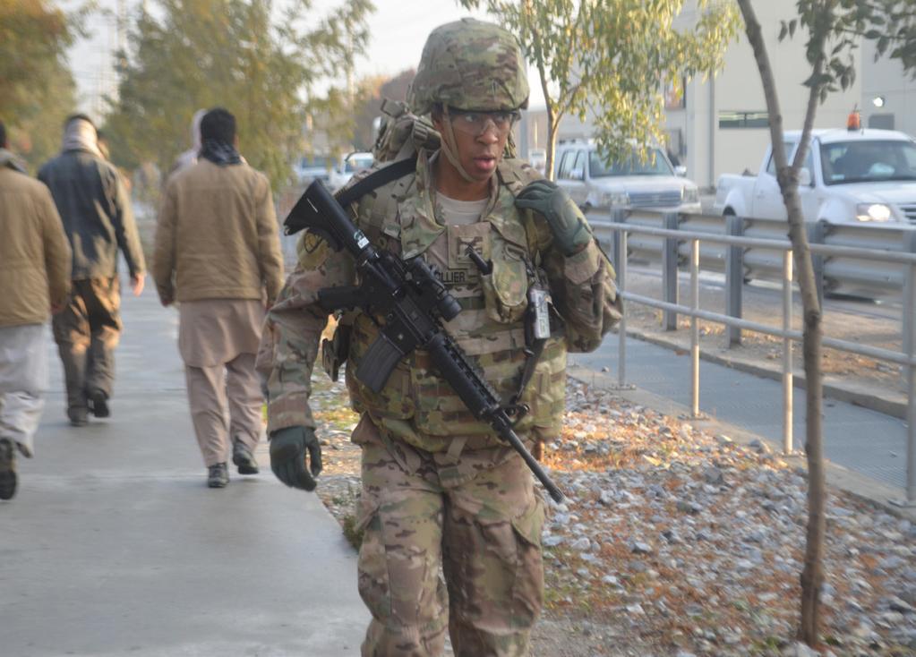 participates in the ruck march portion of the 25th Signal Battalion NCO of the Quarter competition Nov. 13, 2015.