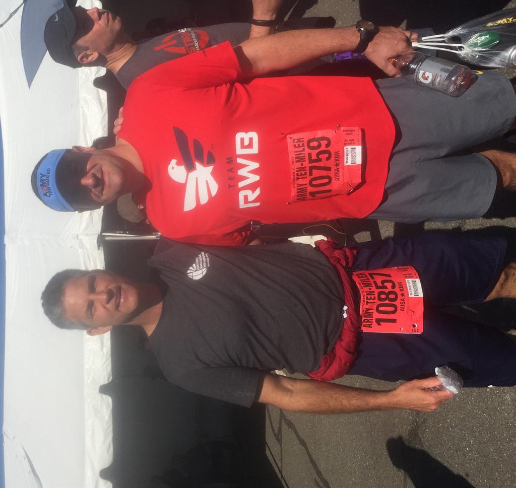 J.R. Bass, State Army Aviation Office, and Chief Warrant Officer 3 Jeff Bahr, B Co. 1-169th, pose after completing the Army 10-Miler here, Oct. 11, 2015.